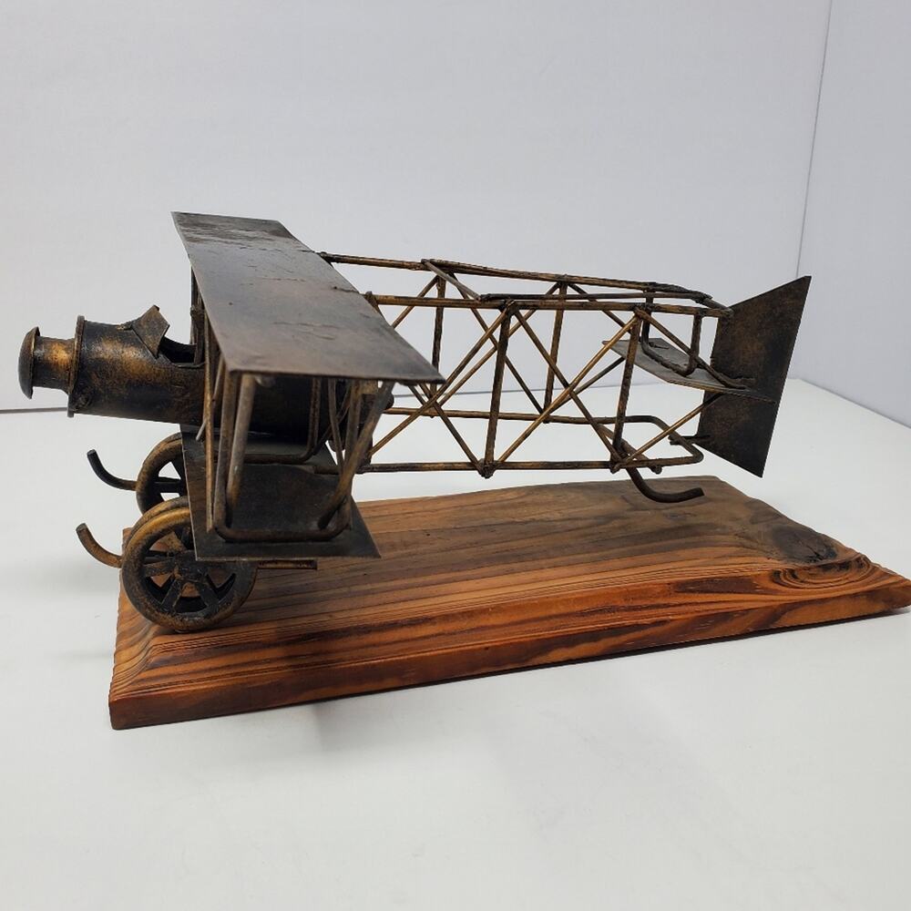 Vintage metal bi-plane with a hard wood base 12" Long 5" tall